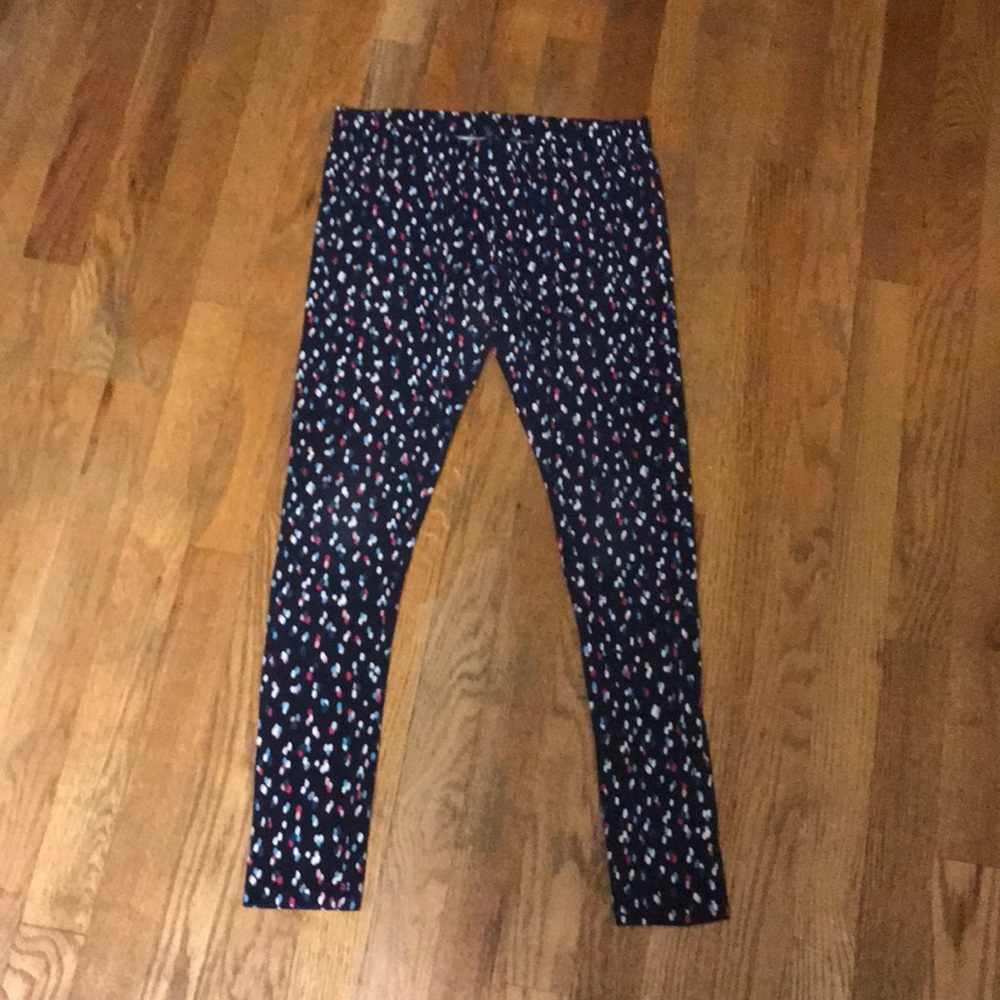 Black, white, pink, blue, orange colored leggings.